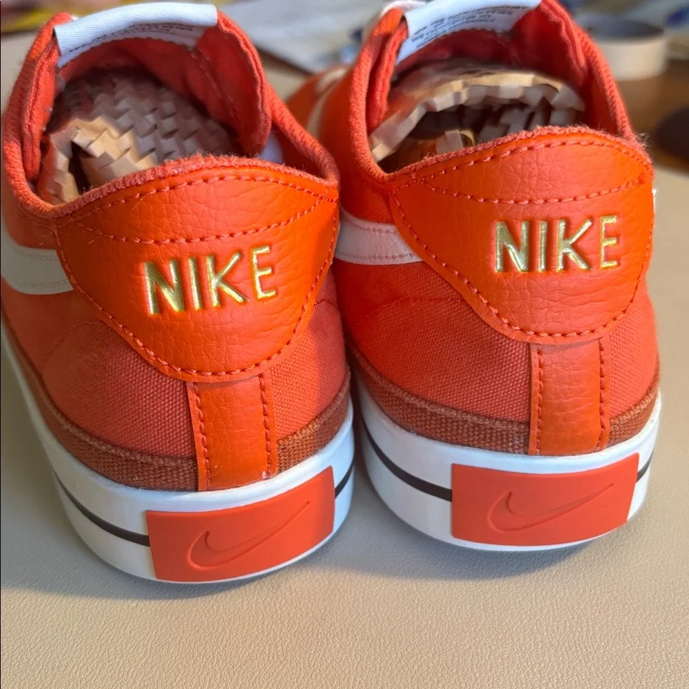 Nike Men's Bright Orange Canvas Low-Top Sneakers with White Swoosh